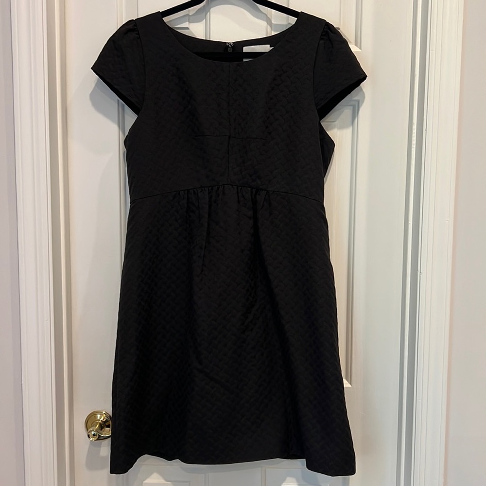 HD in Paris black dress.